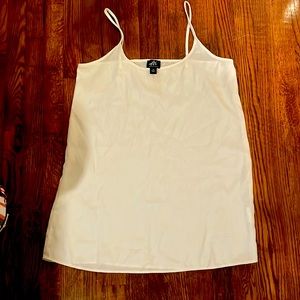 White XS flowy silk type material spaghetti strap tank.